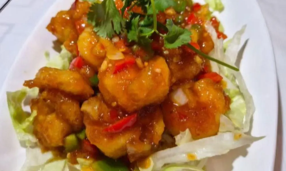 Sweet and Sour Shrimp Succulent shrimp in a sweet and sour sauce, garnished with bell peppers and coriander at Bamboo Cafe, a Chinese Restaurant restaurant in Glendale