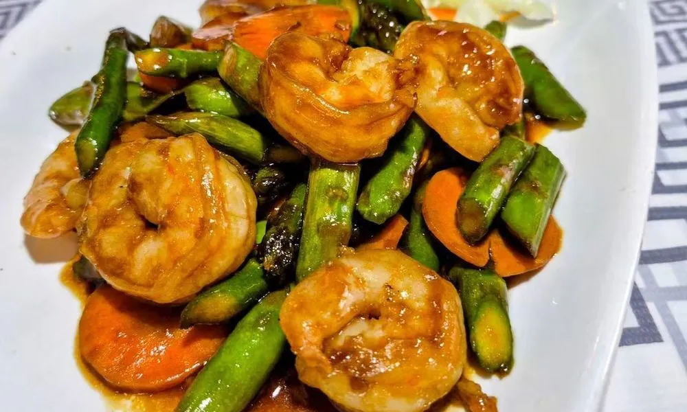 Shrimp and Vegetable Stir-Fry Stir-fried shrimp with asparagus, carrots, and sauce at Bamboo Cafe, a Chinese Restaurant restaurant in Glendale