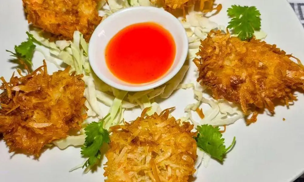Crispy Shrimp Golden-brown fried shrimp served with sauce and garnished with herbs at Bamboo Cafe, a Chinese Restaurant restaurant in Glendale