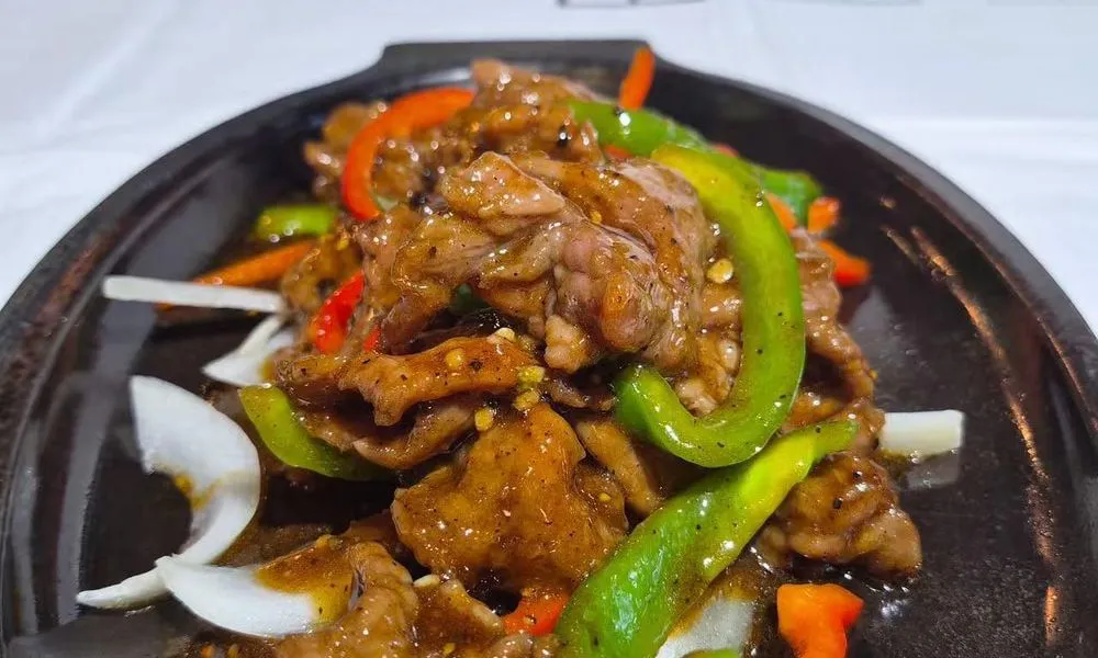 Beef and Bell Pepper Sliced beef with green and red bell peppers at Bamboo Cafe, a Chinese Restaurant restaurant in Glendale