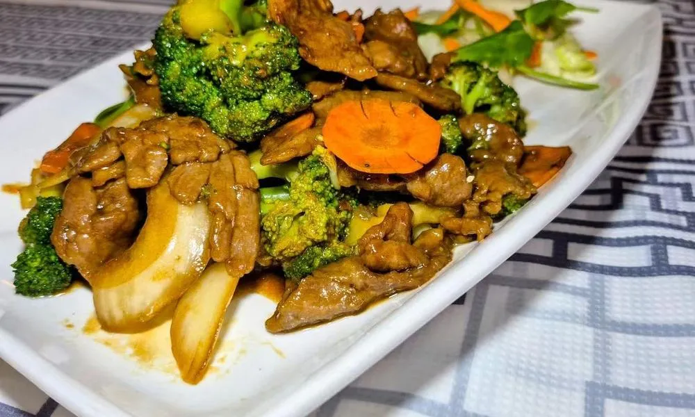 Beef and Broccoli Succulent beef slices with tender broccoli florets at Bamboo Cafe, a Chinese Restaurant restaurant in Glendale