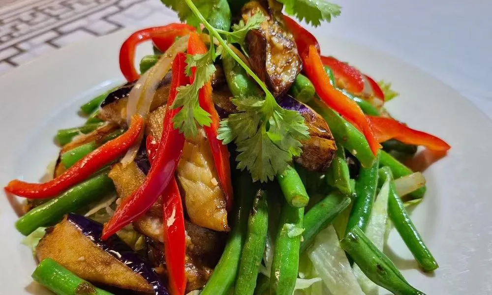 Mixed Vegetables A colorful mix of grilled eggplant, red bell peppers, green beans, and lettuce at Bamboo Cafe, a Chinese Restaurant restaurant in Glendale