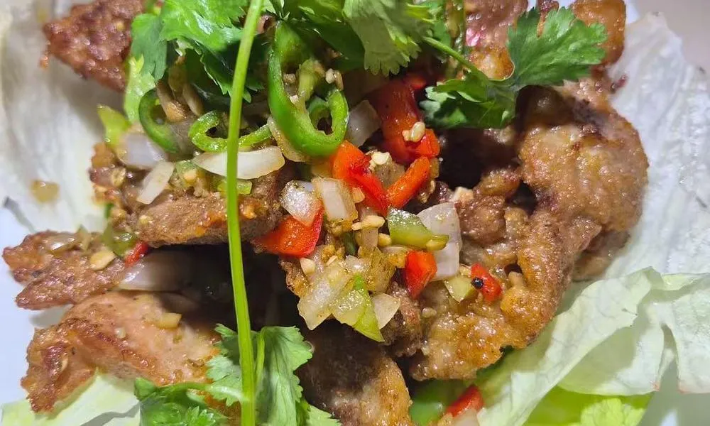 Fried Pork Chop Crispy fried pork chop with vegetables and herbs at Bamboo Cafe, a Chinese Restaurant restaurant in Glendale
