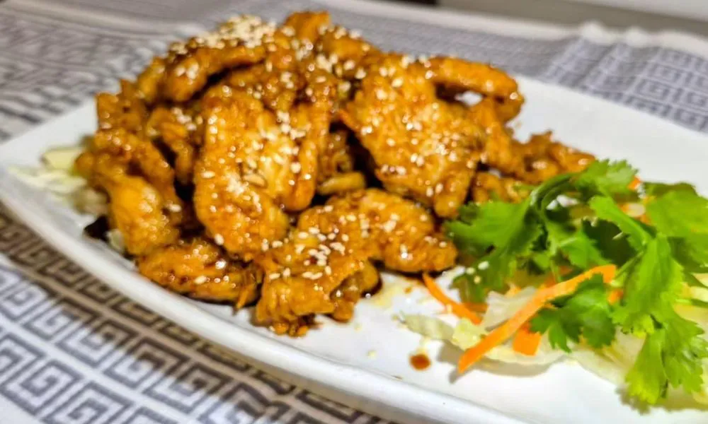 General Tso's Chicken Succulent chicken pieces in a sweet and spicy sauce at Bamboo Cafe, a Chinese Restaurant restaurant in Glendale
