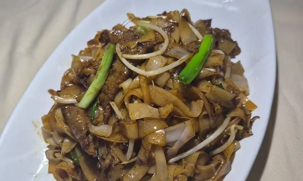 Fried Mee Noodles stir-fried with meat and green onions at Bamboo Cafe, a Chinese Restaurant restaurant in Glendale
